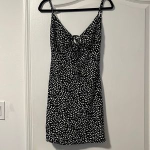 Mini black and white dress with milkmaid-style detailing from Commense.